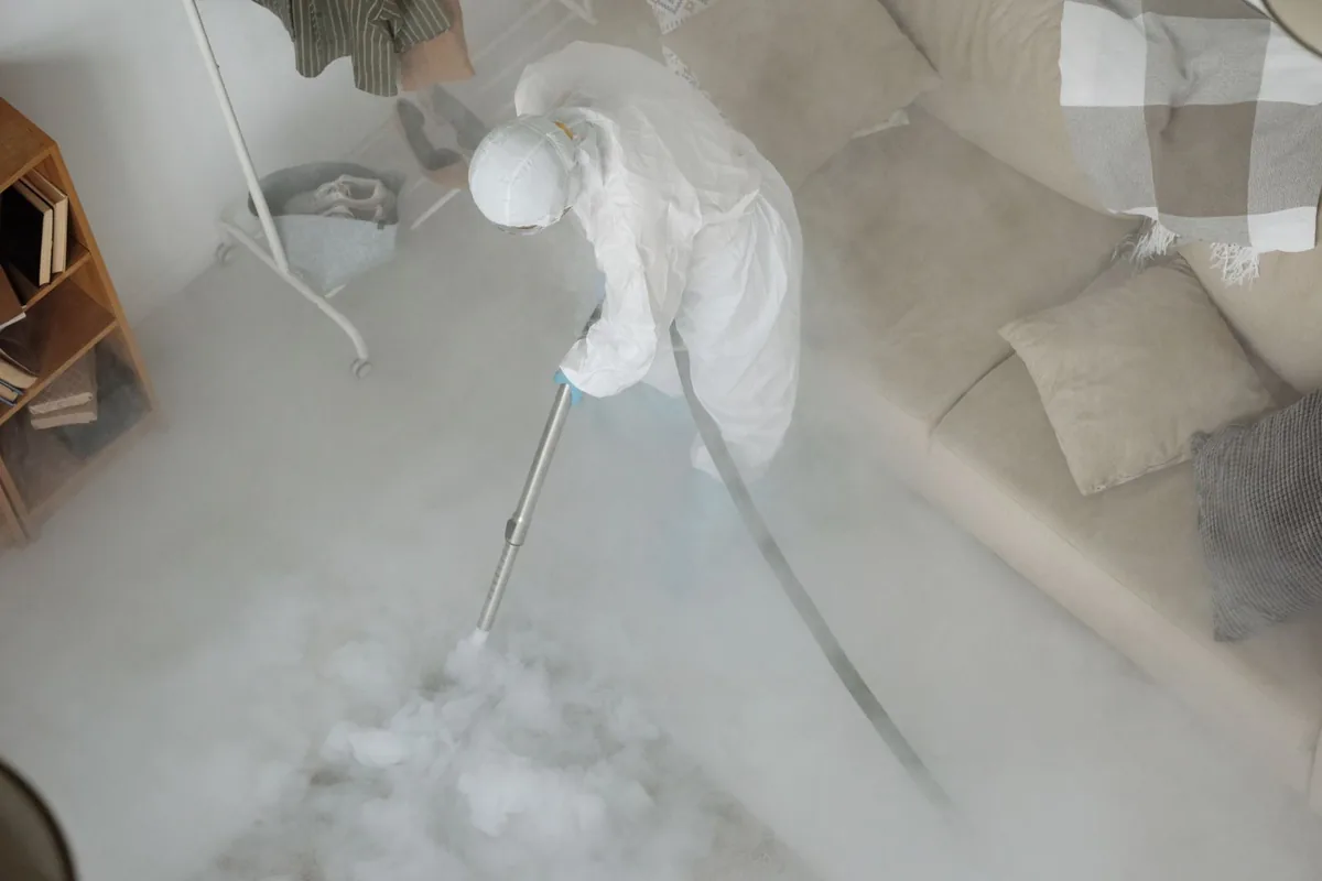 Biohazard cleanup technician in protective equipment, Mission, TX